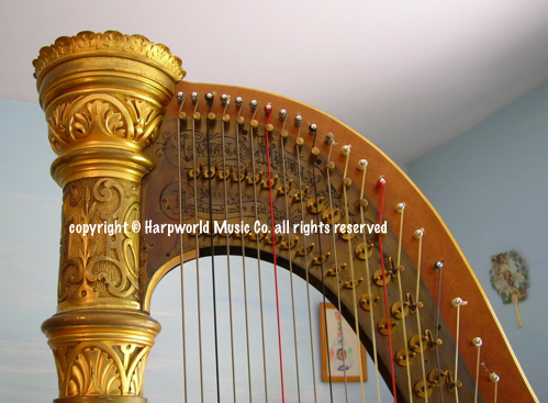 Lyon & Healy gilded harp, detail of crown & neck